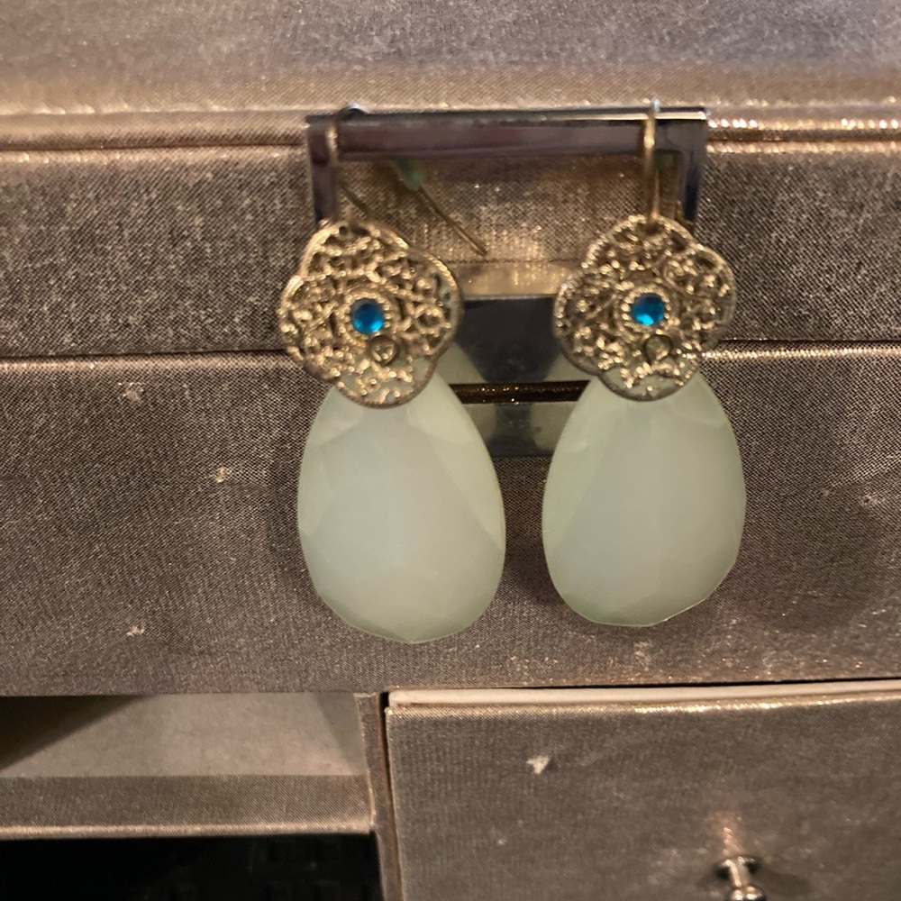 gold teardrop earrings with torquise gem in the center